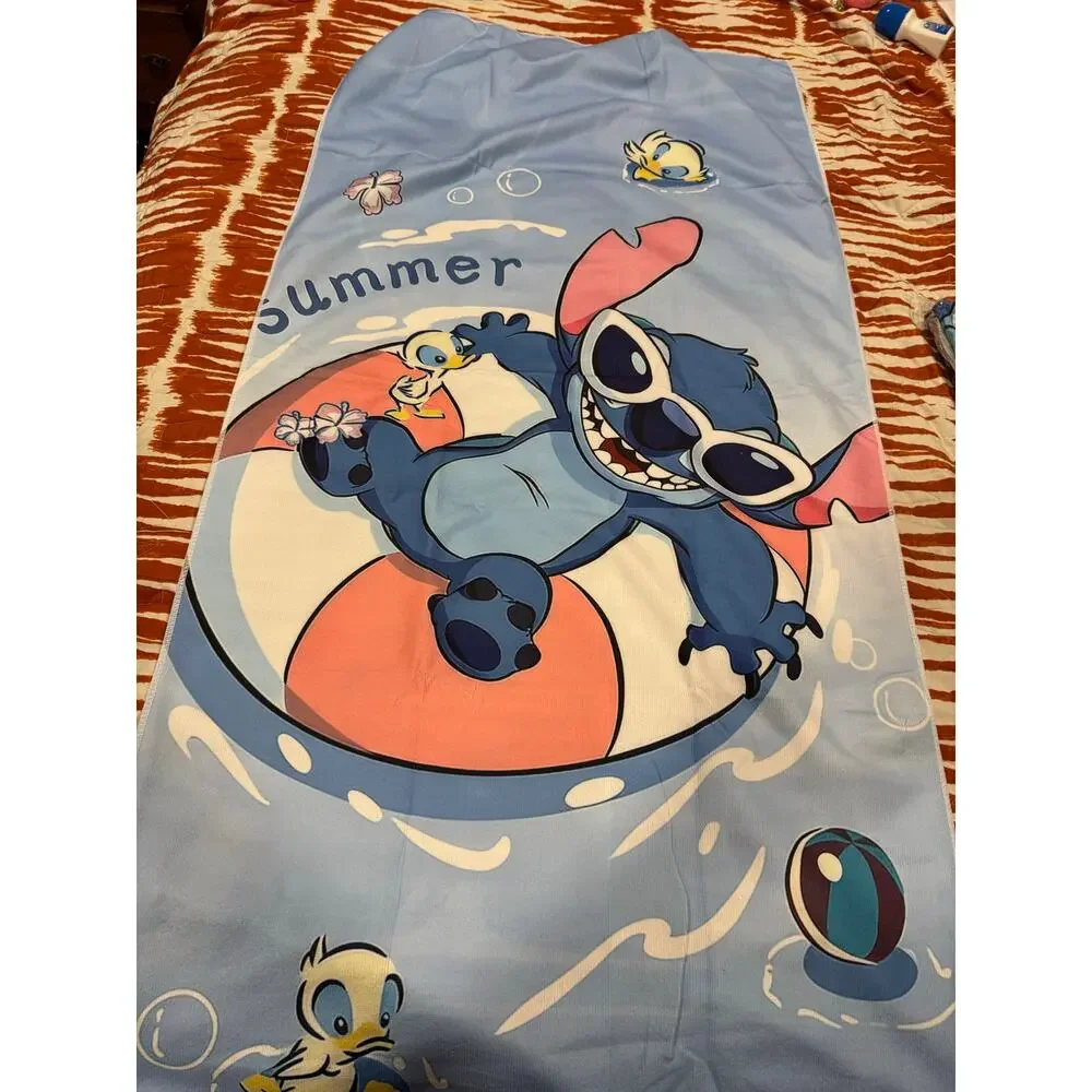 Stitch beach towel with Stitch wearing sunglasses on a live saver'
